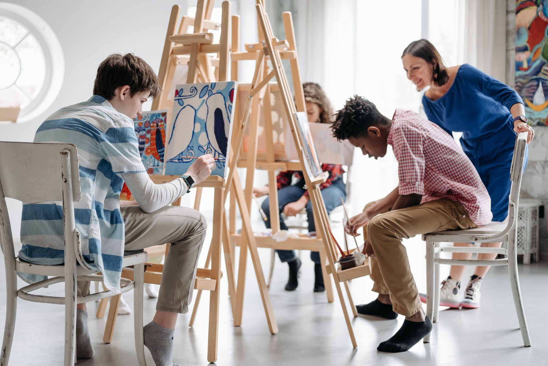 Children painting during a supervised art activity